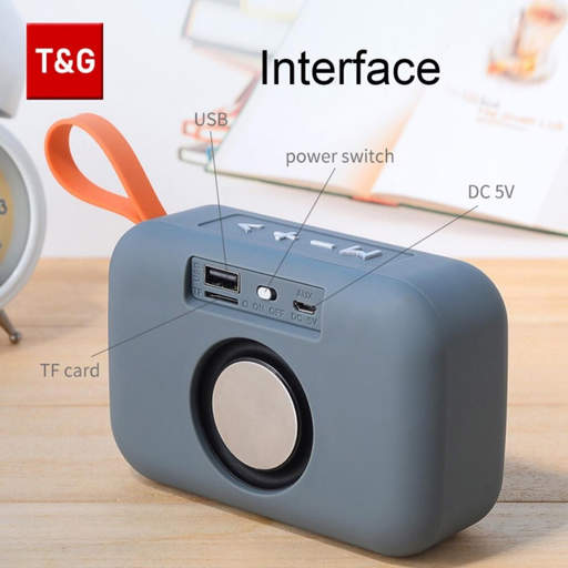 a t & g logo is above a gray speaker