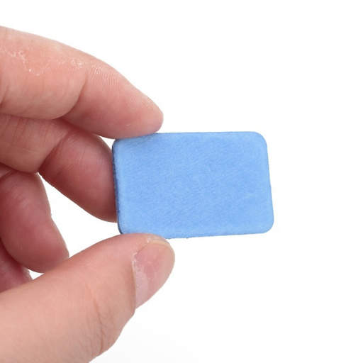 a person is holding a blue eraser in their hand