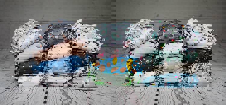 a stack of diapers with different designs on them