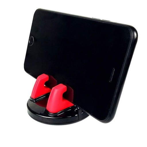 a cell phone is sitting on a red and black holder