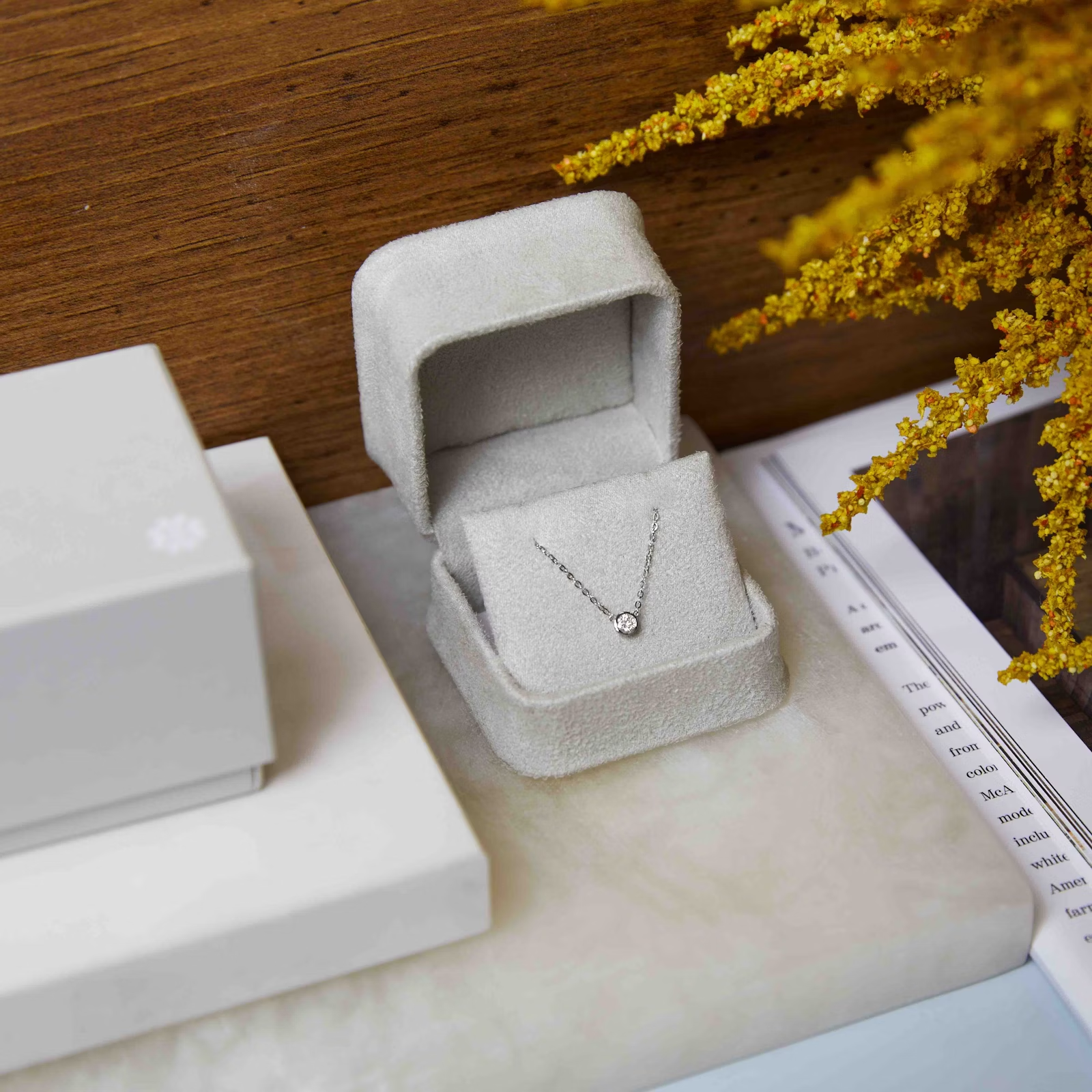 a necklace is sitting in a box on a table