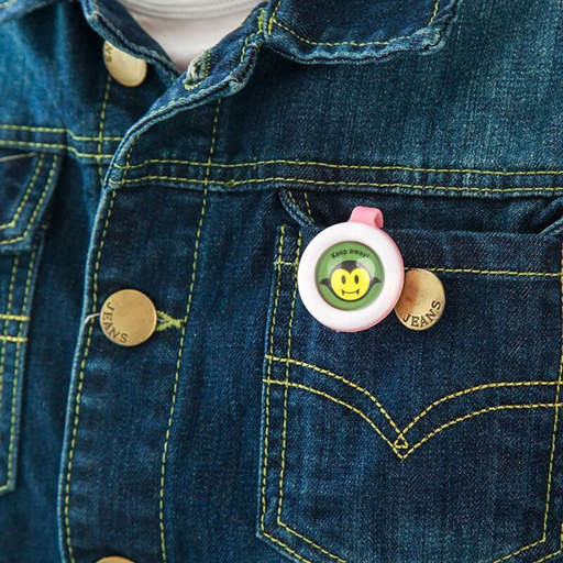 a person wearing a denim jacket with a button that says jeans