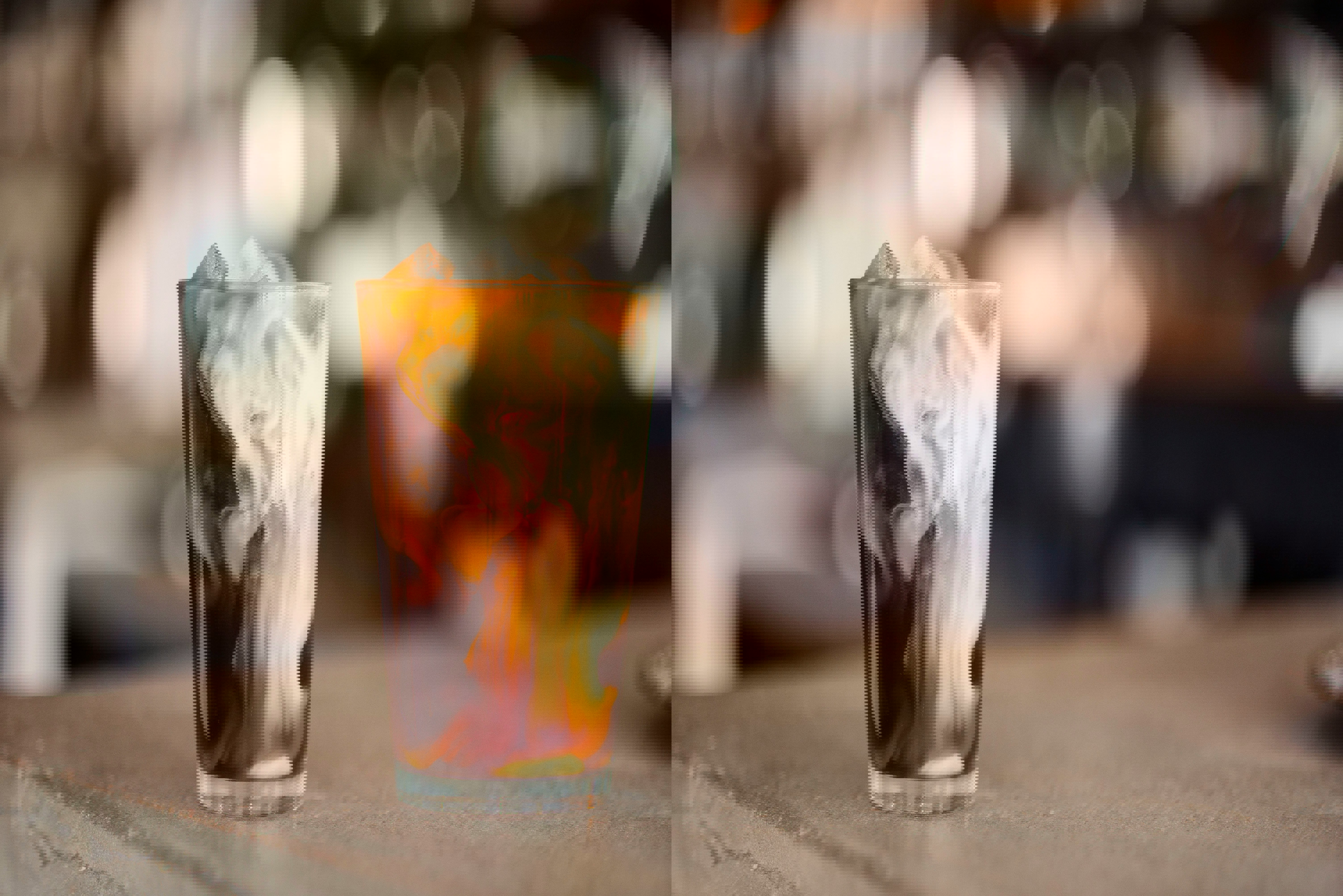 a glass of iced coffee on a counter top