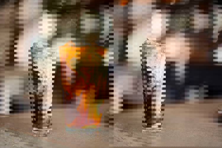 Cold brew with cream a glass of iced coffee on a counter top