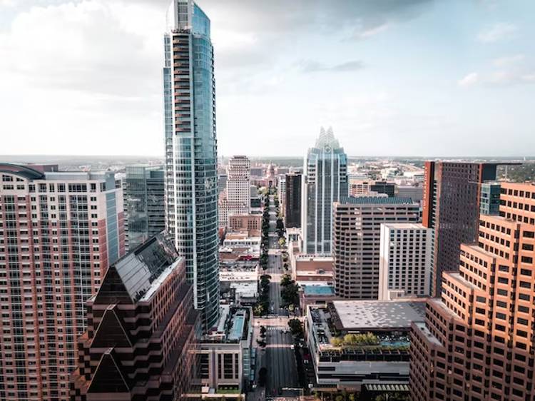 an aerial view of a city with a lot of tall buildings