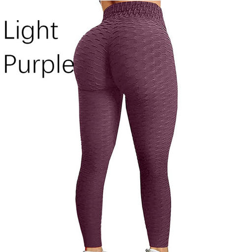 a woman is wearing a pair of light purple leggings .