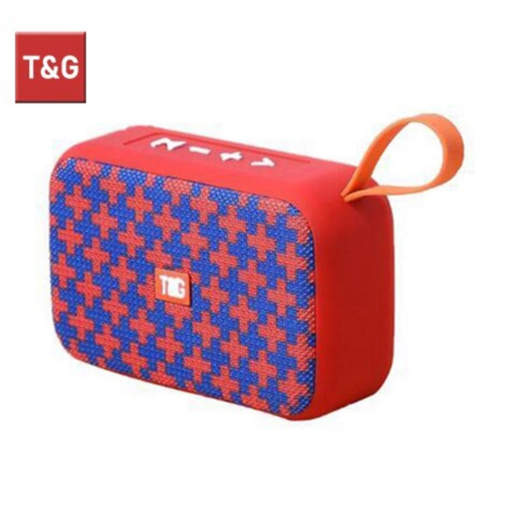 a red and blue t & g speaker with a handle