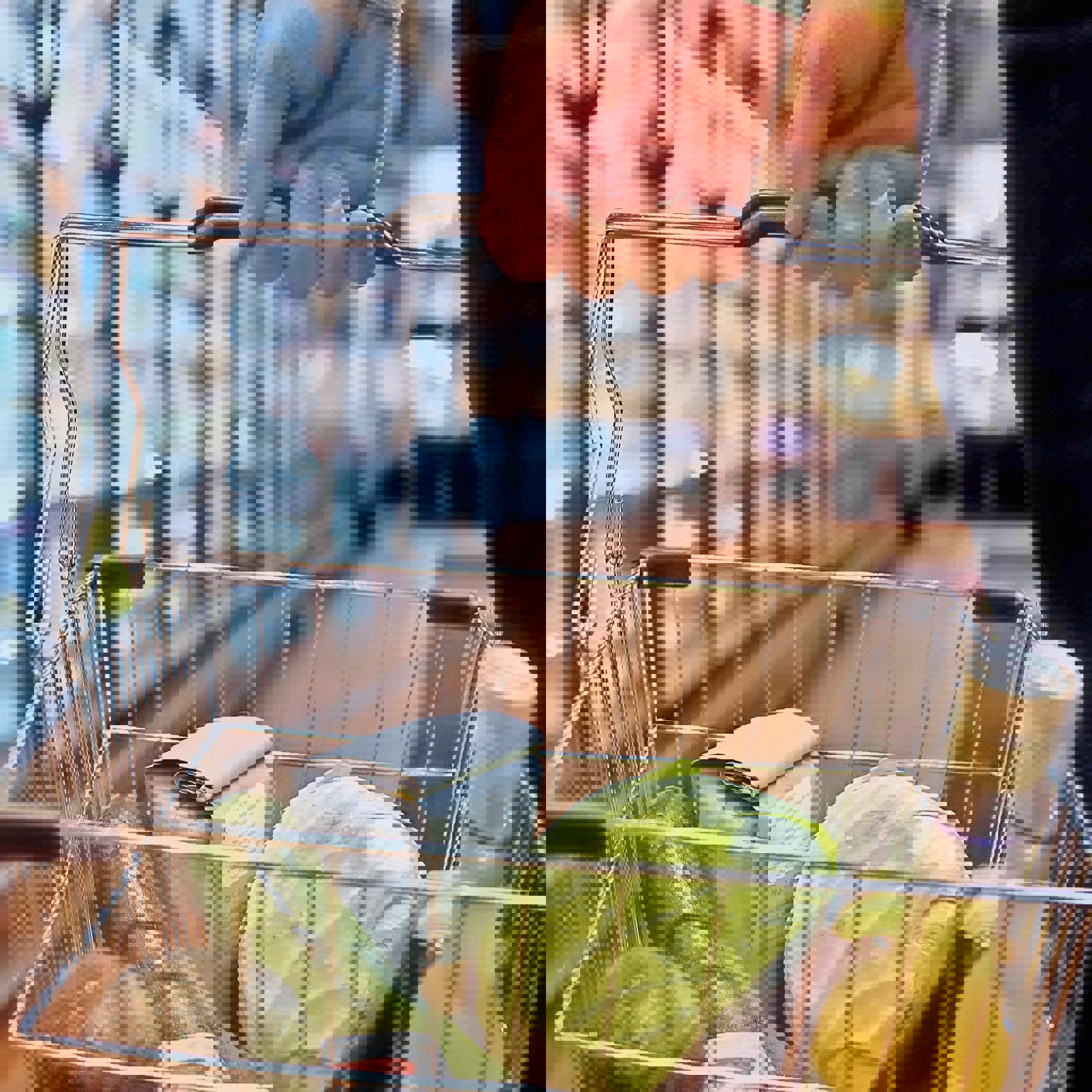 a person is pushing a shopping cart full of groceries in a grocery store