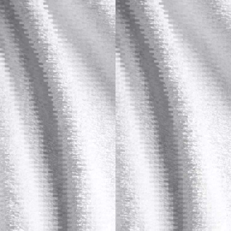 a close up of a white towel showing the texture