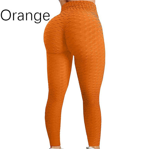 a woman is wearing a pair of orange leggings