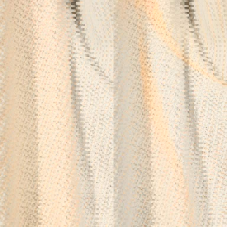 a close up of a white sweater with a turtleneck
