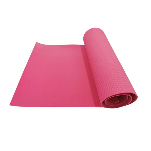a pink yoga mat is rolled up on a white background