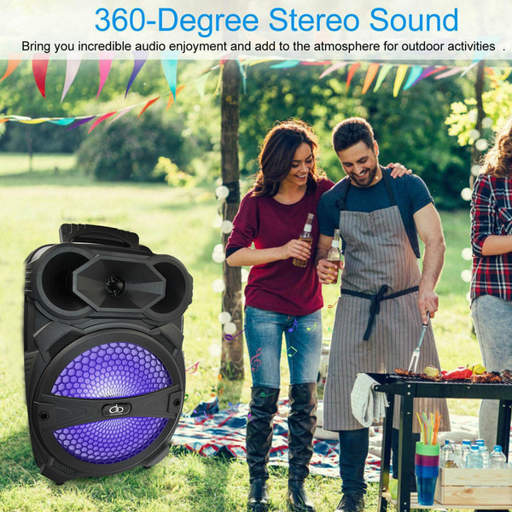 a group of people standing in a field with a speaker that says 360-degree stereo sound