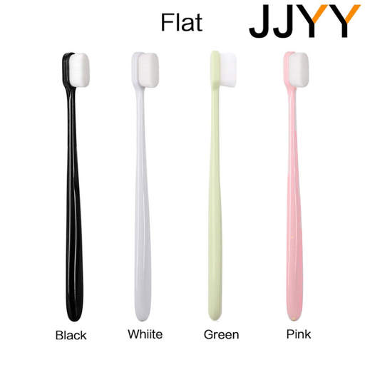 four toothbrushes in black white green and pink
