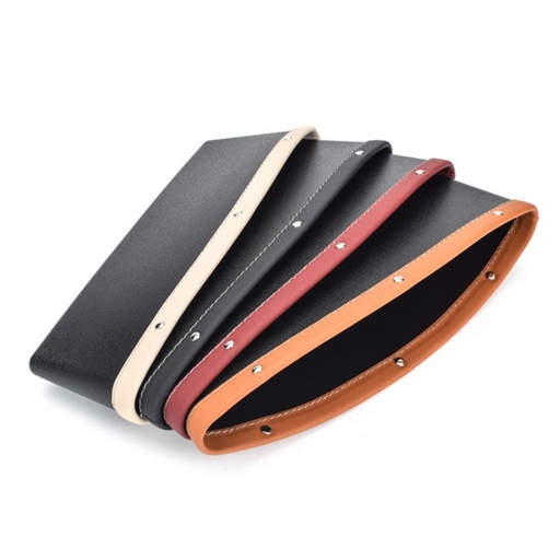 four different colored leather wallets are stacked on top of each other