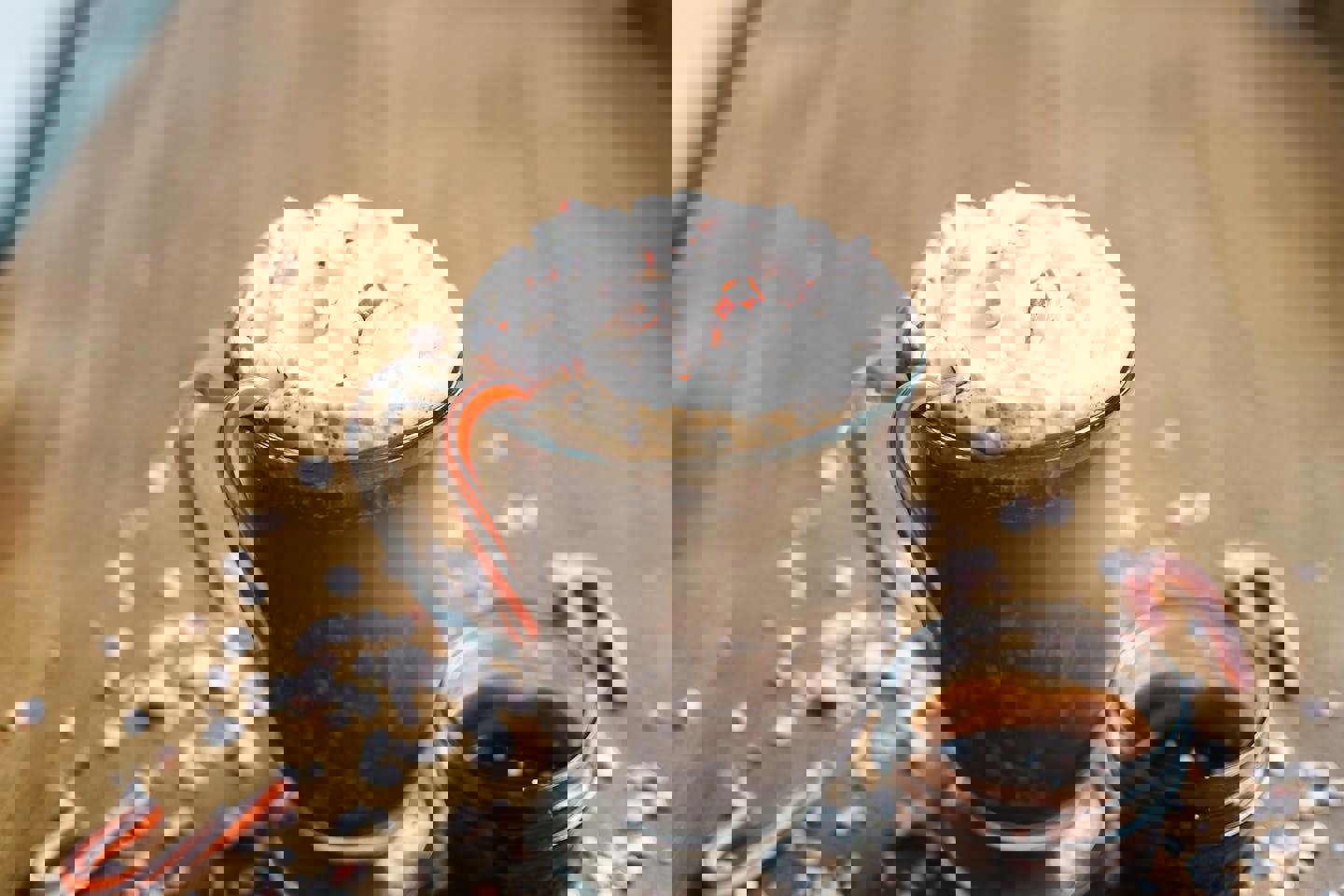 a cup of hot chocolate with whipped cream and candy canes