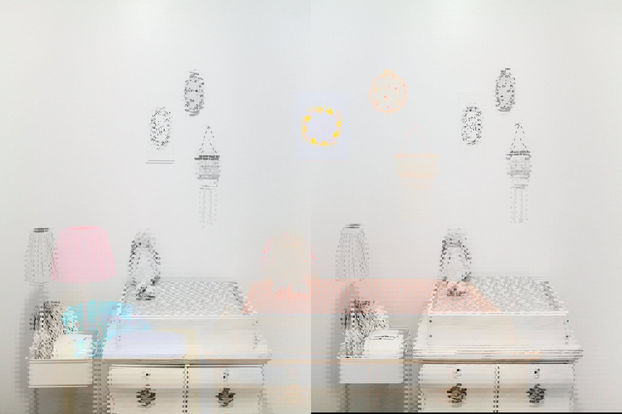 a room with a changing table and a lamp