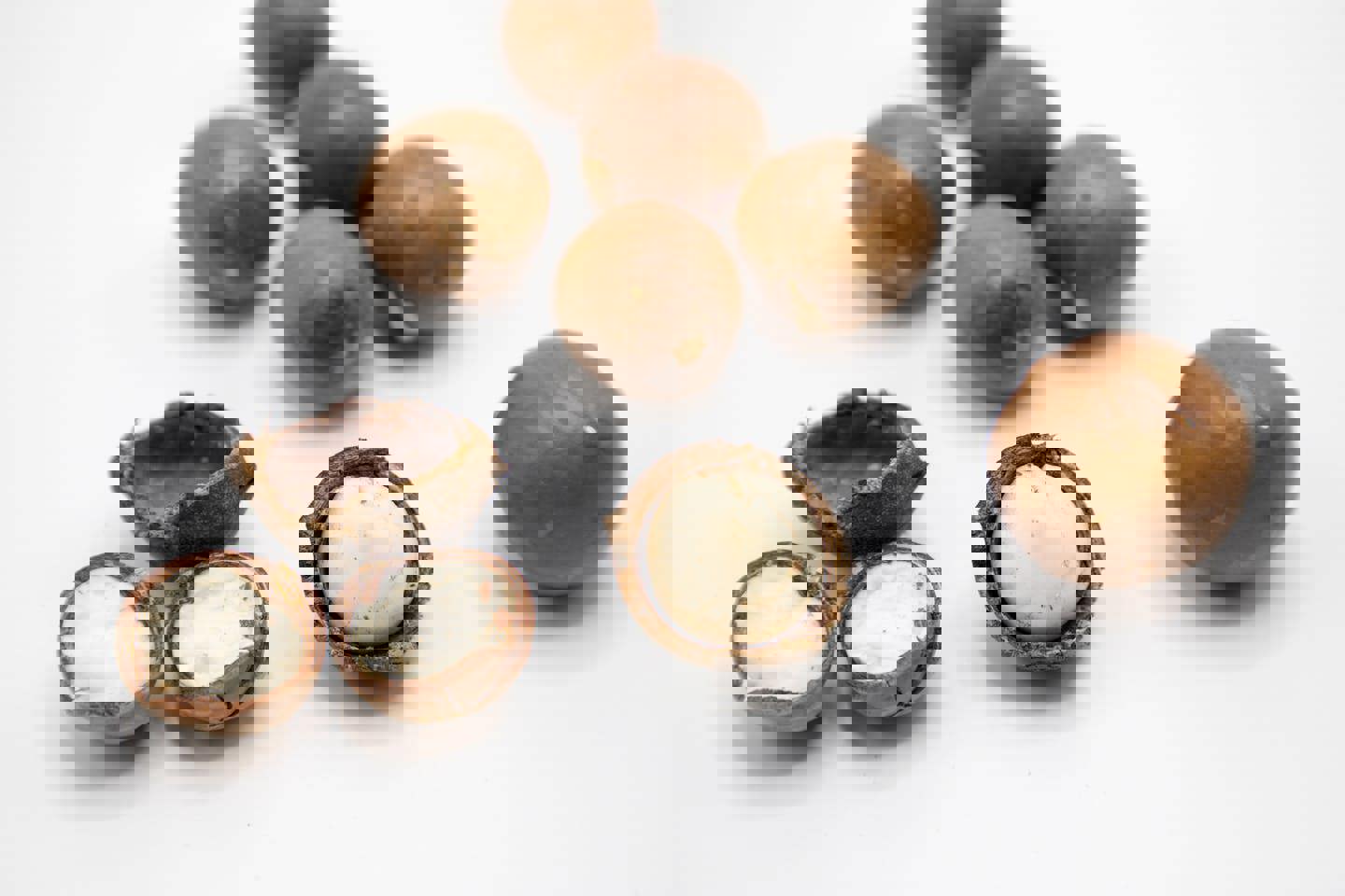 macadamia nuts are peeled and ready to be eaten on a white background