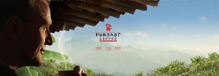 a man is drinking a cup of puroast coffee