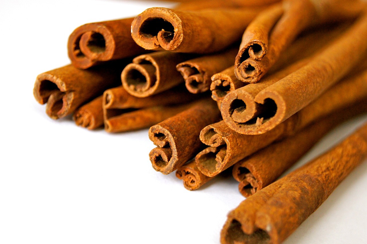 a bunch of cinnamon sticks are stacked on top of each other