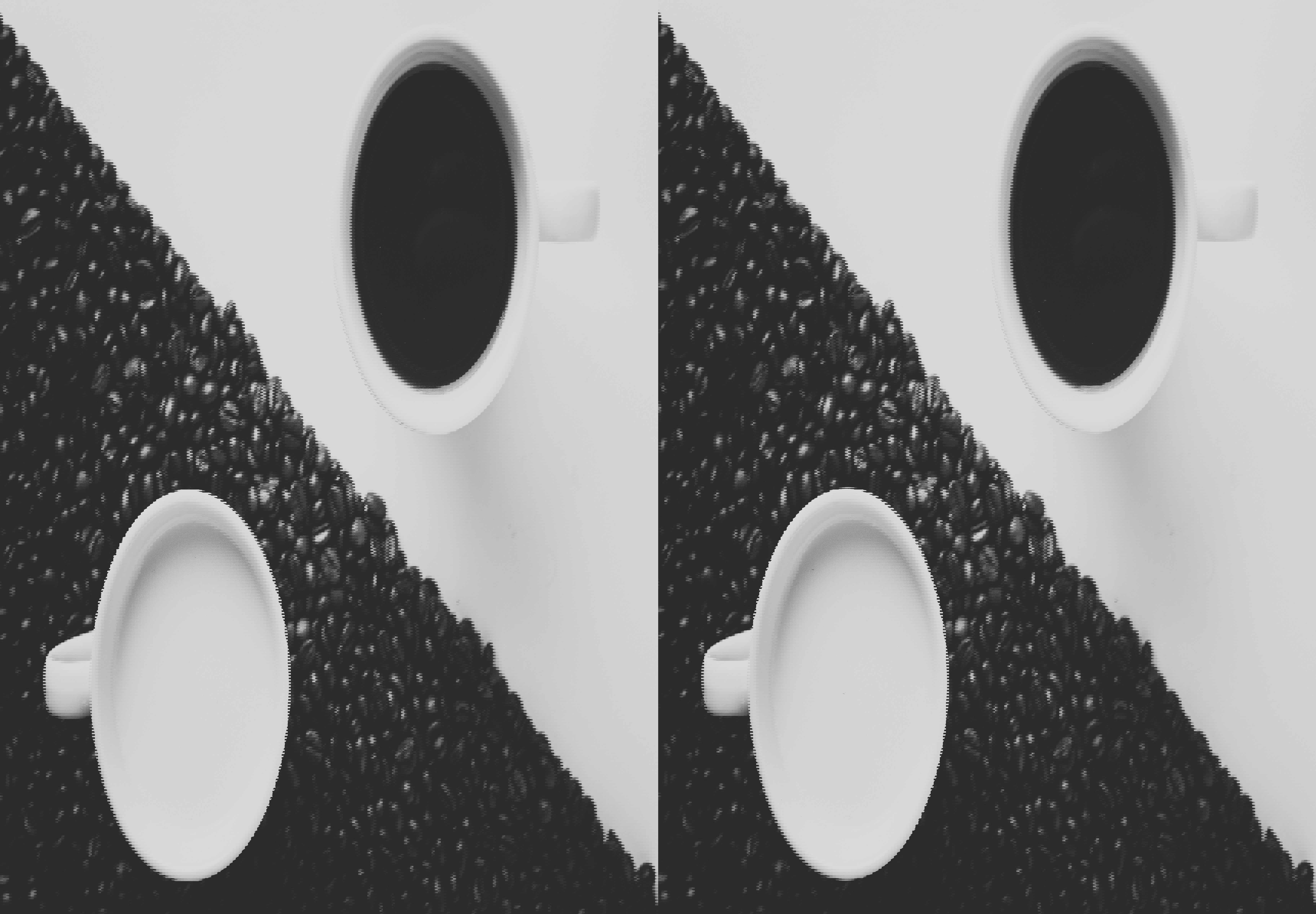 two cups of coffee sit on a pile of coffee beans