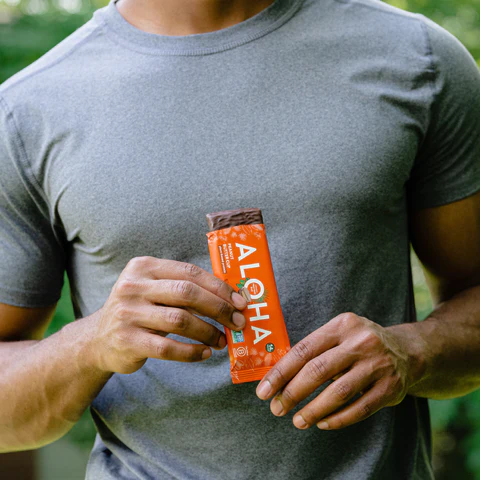 a man is holding a aloha bar in his hands