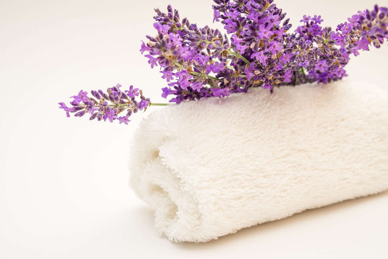 a white towel with purple flowers on it