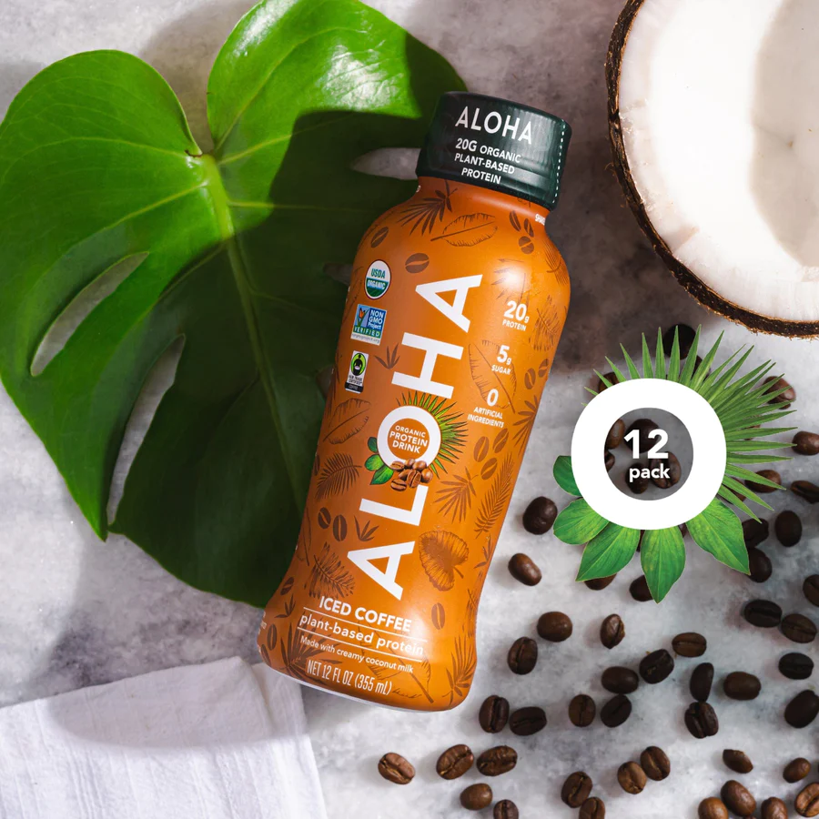 a bottle of aloha iced coffee surrounded by coffee beans