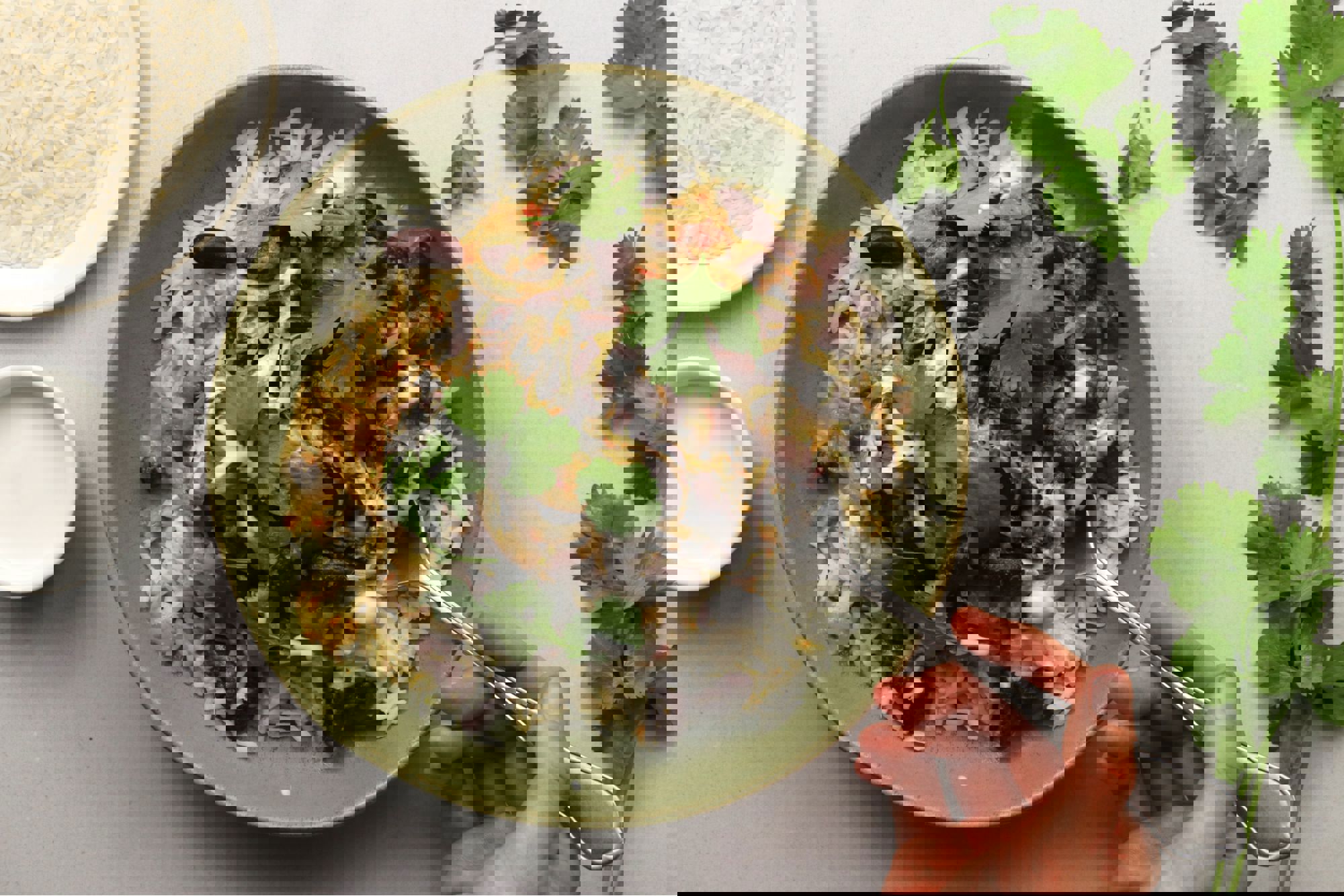 a bowl of rice and beans with a spoon in it