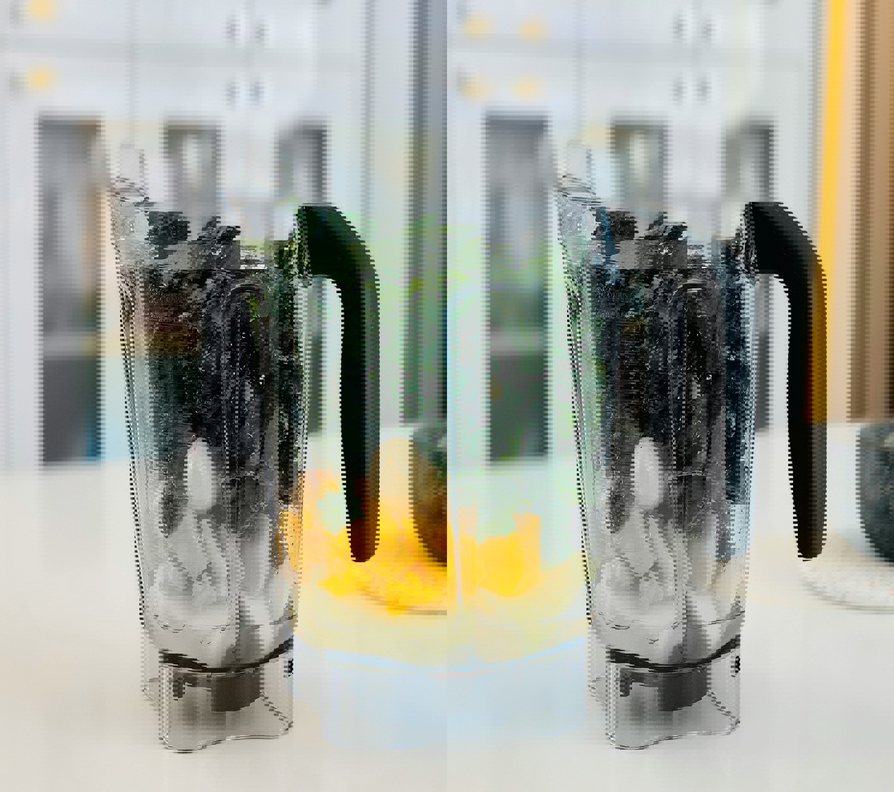 a blender filled with a variety of fruits and vegetables