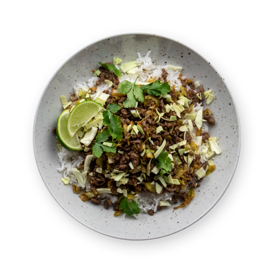a bowl of food with rice , meat , cabbage and lime wedges on a white background