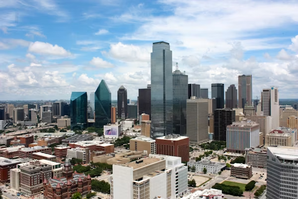 an aerial view of the city skyline of dallas on a cloudy day