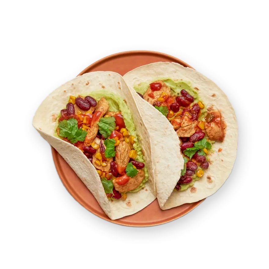 a close up of two tacos on a plate on a black background
