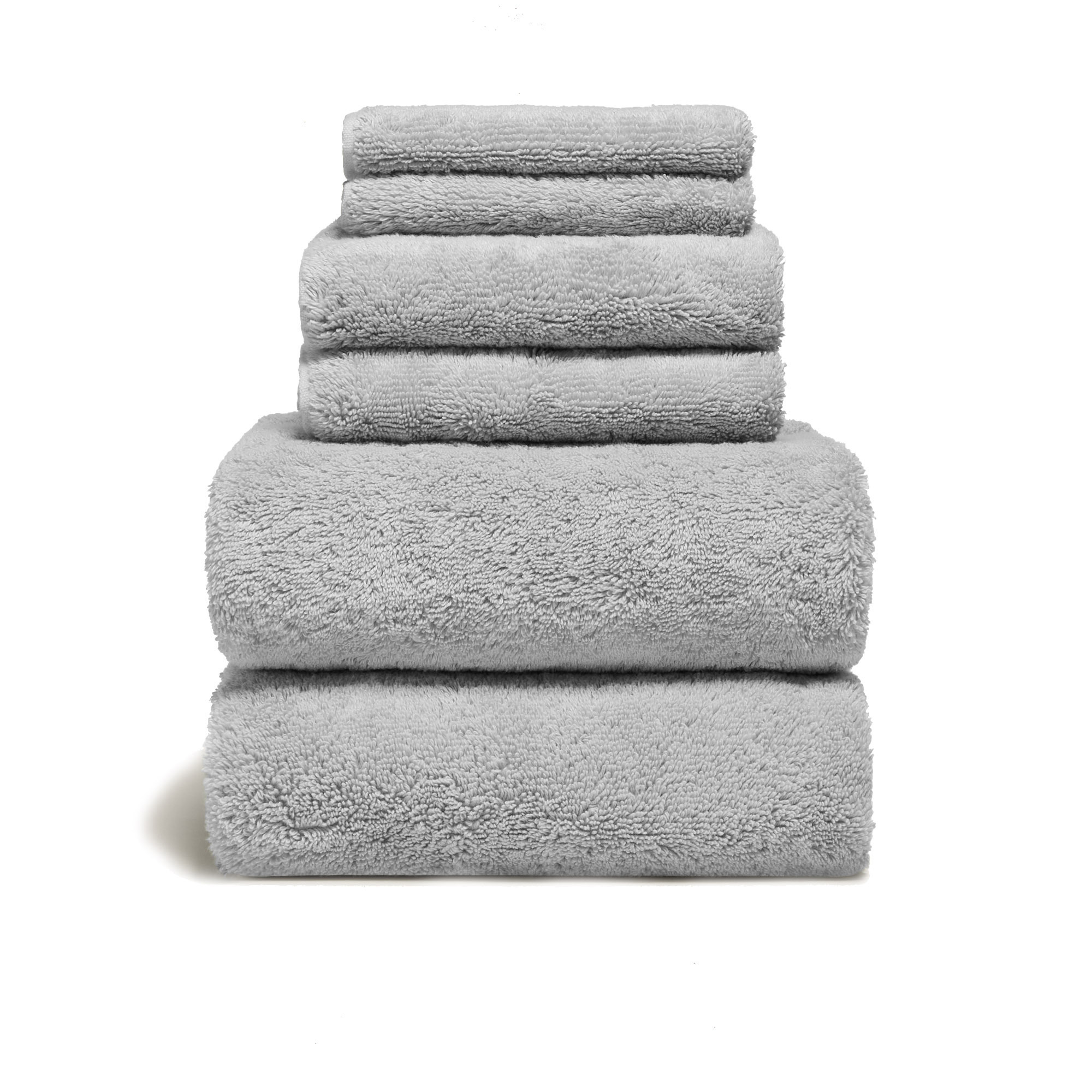 a stack of grey towels on a white background