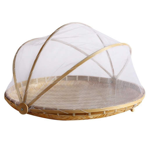 a wicker basket with a mosquito net on top of it