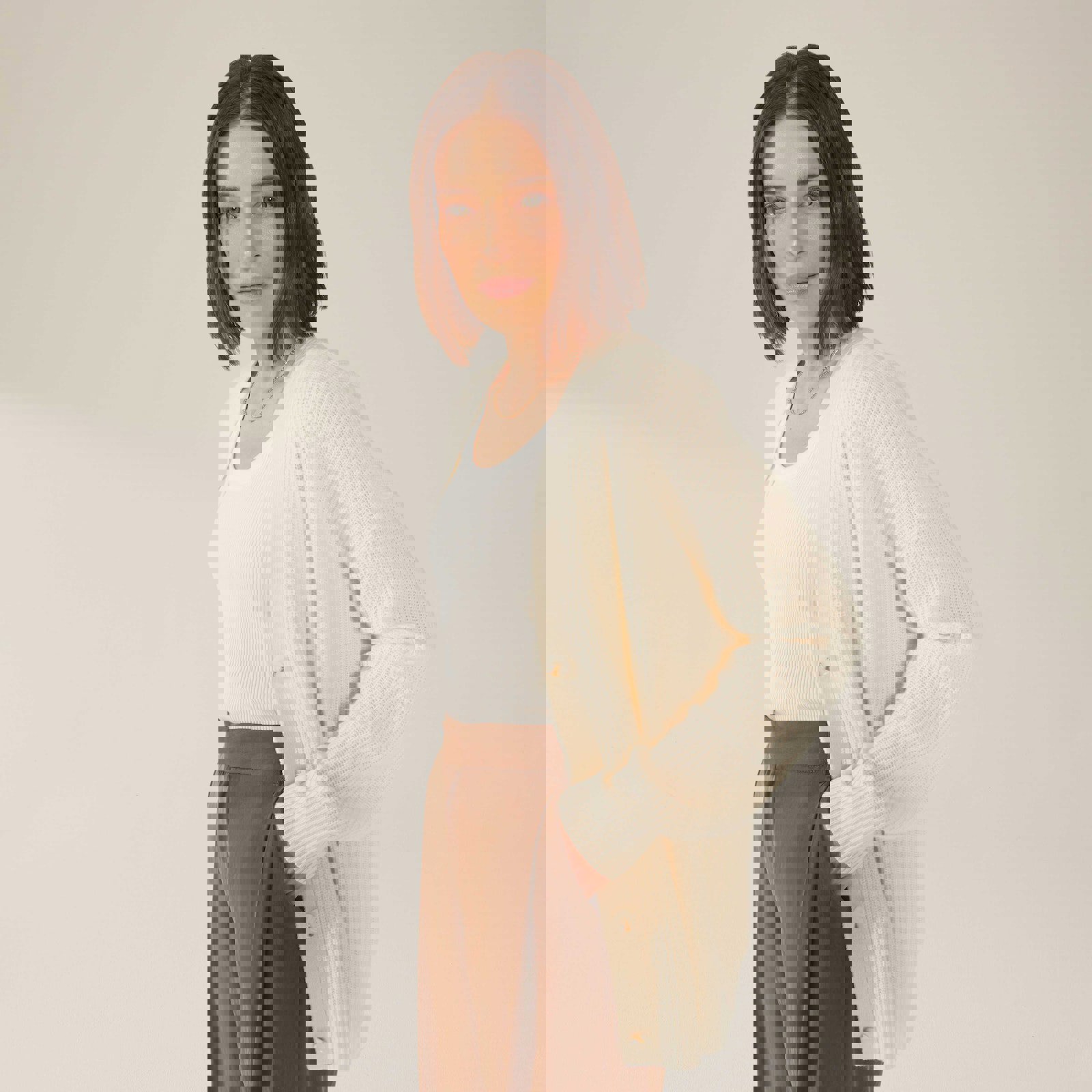 a woman wearing a white cardigan and brown pants