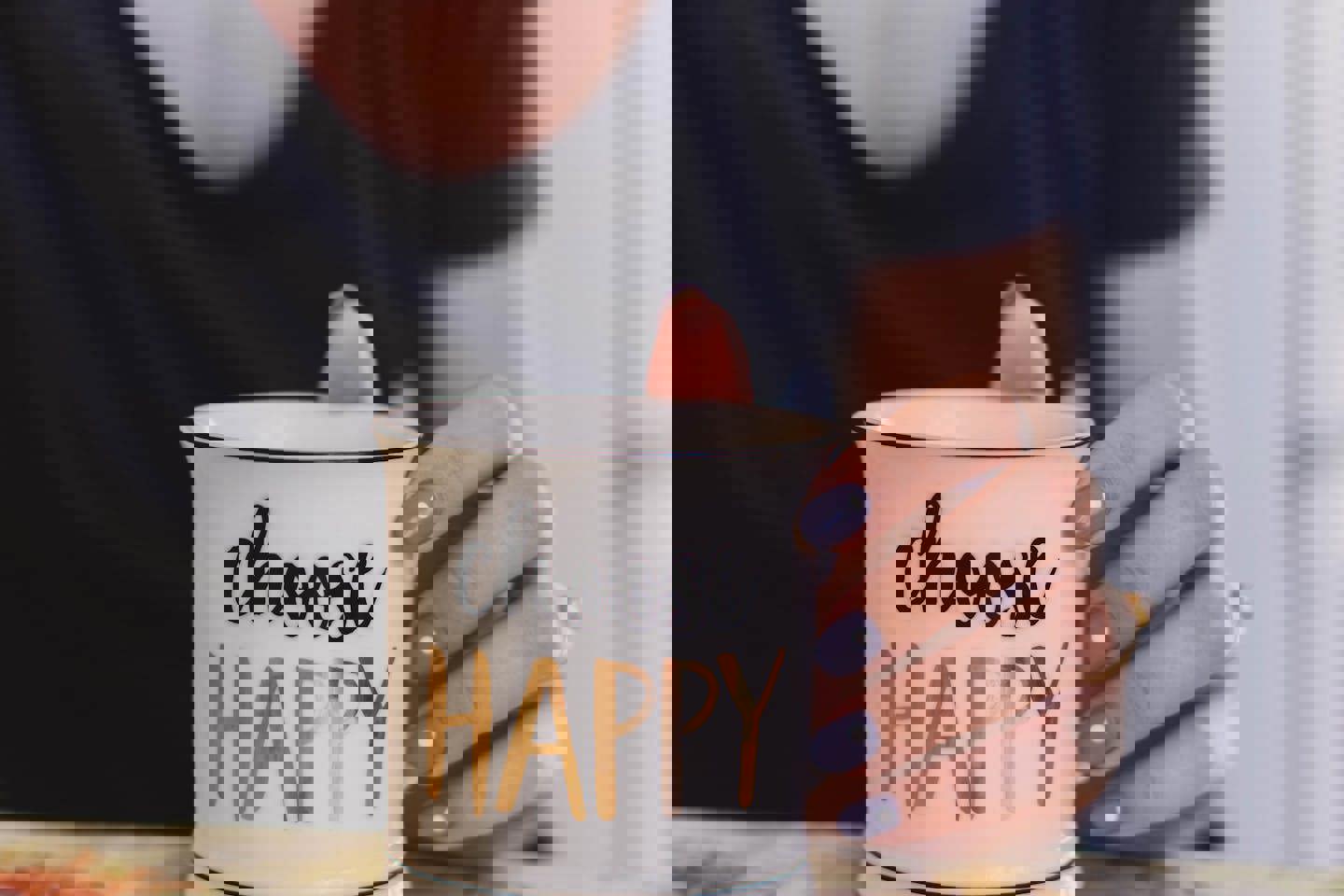 a woman is holding a mug that says choose happy