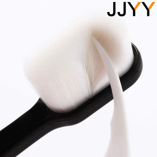 a close up of a toothbrush with the word jjyy on the bottom