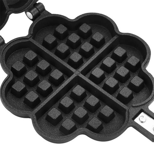 a black waffle maker in the shape of a four leaf clover