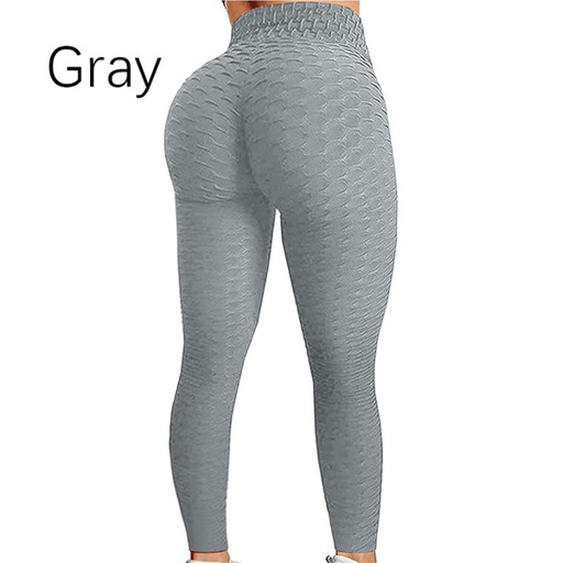 a woman is wearing a pair of gray leggings .