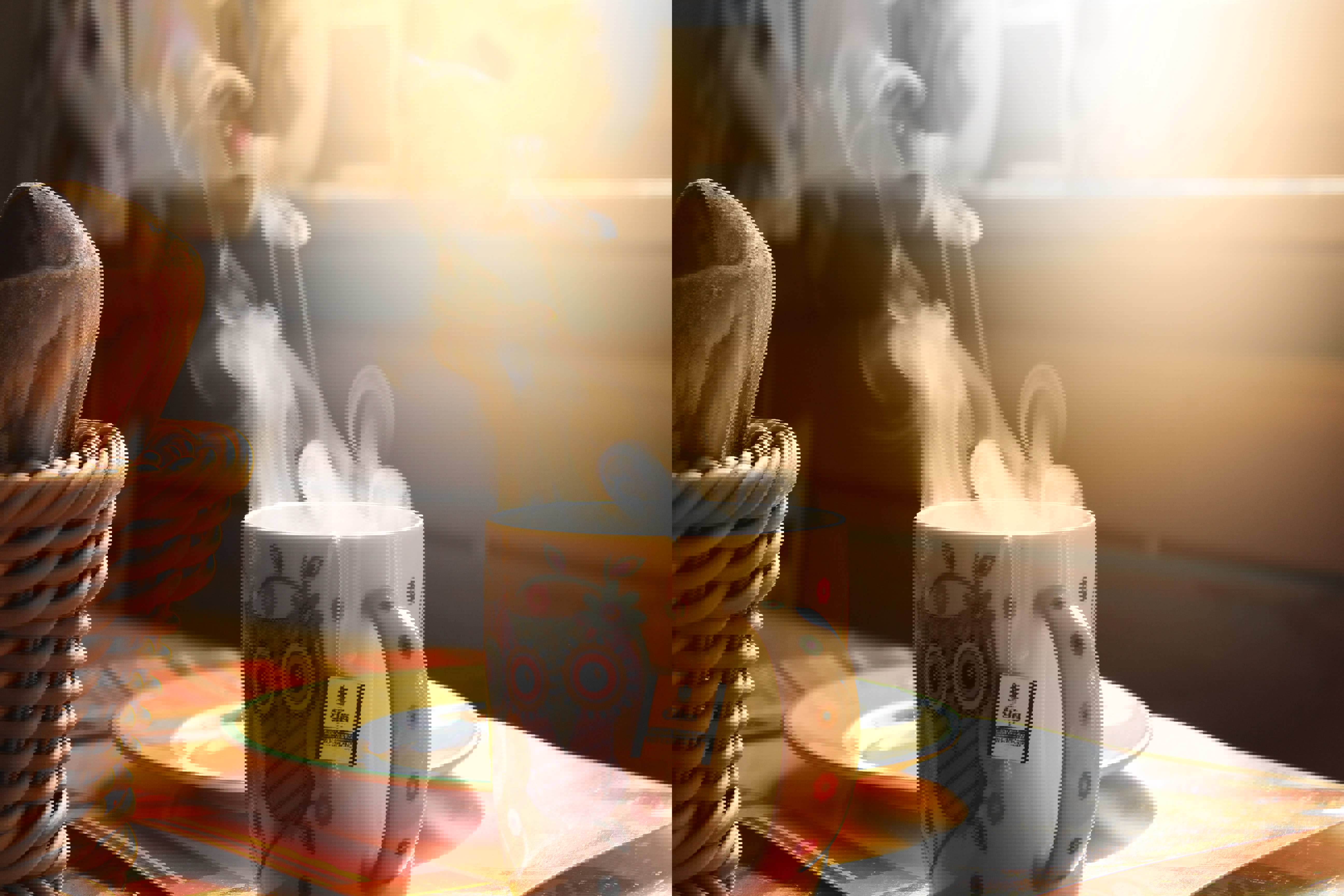 a cup of hot tea with an owl on it