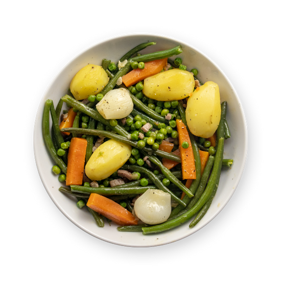 a white bowl filled with potatoes , green beans , carrots and peas