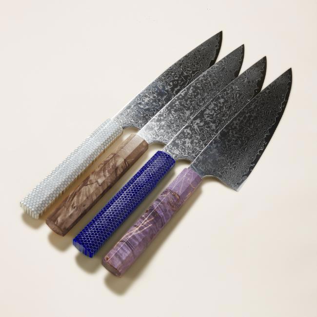 Japanese knifes with gray, brown, blue, and purple handles