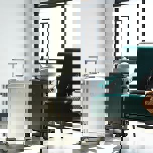 two suitcases are sitting next to each other in a room next to a chair