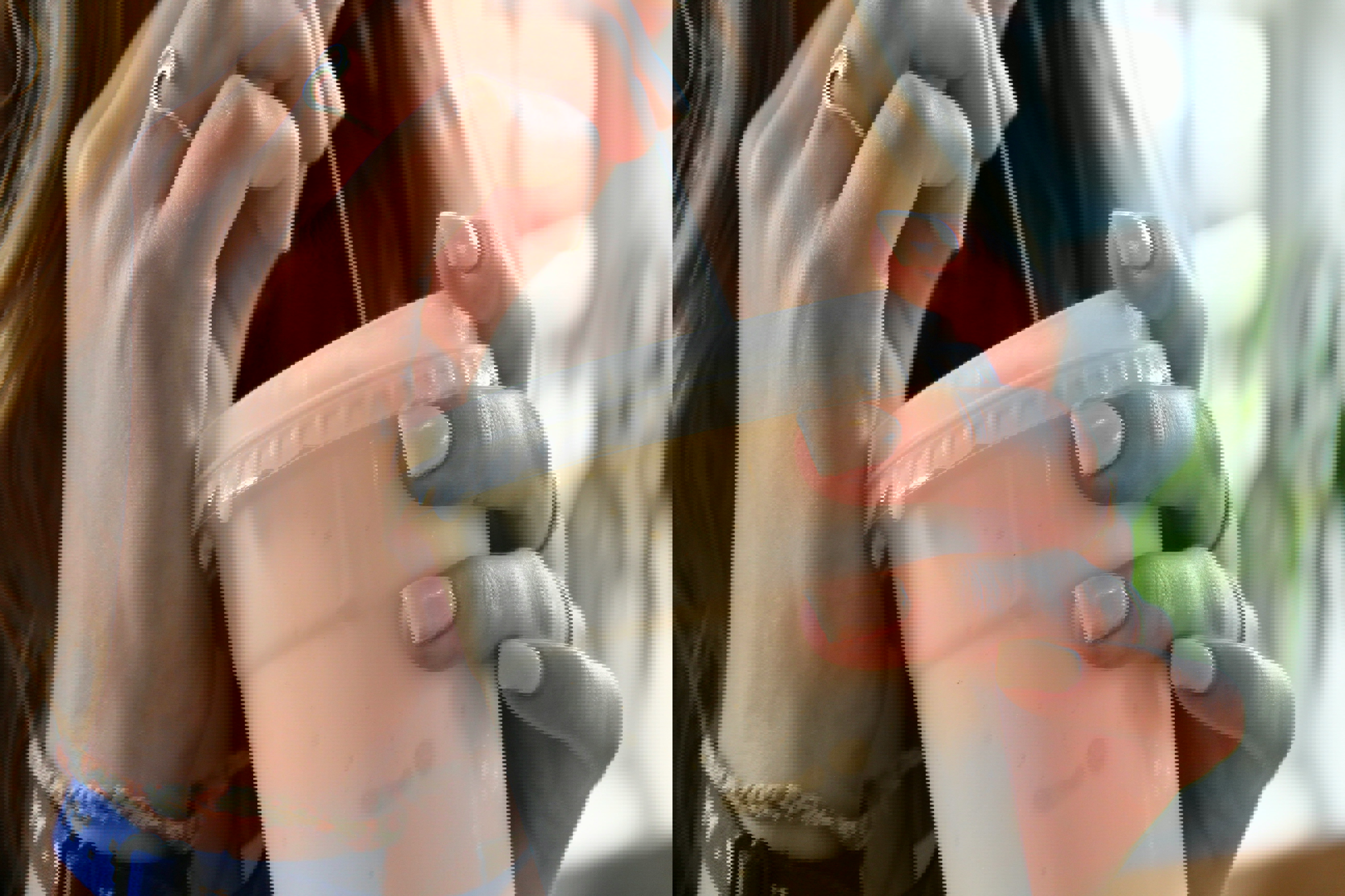 a woman is drinking from a plastic cup with a straw