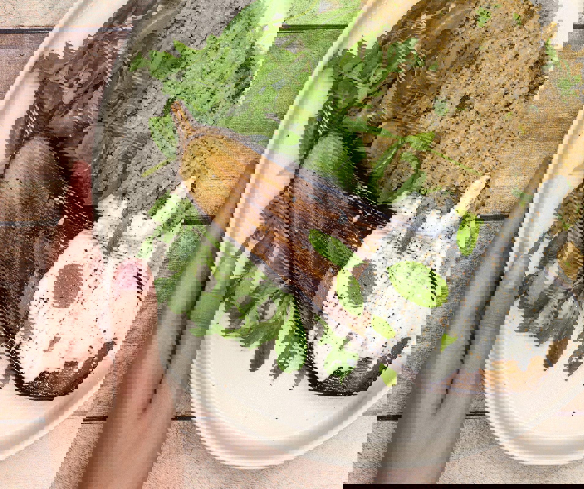 a person is holding a plate of food with rice and vegetables