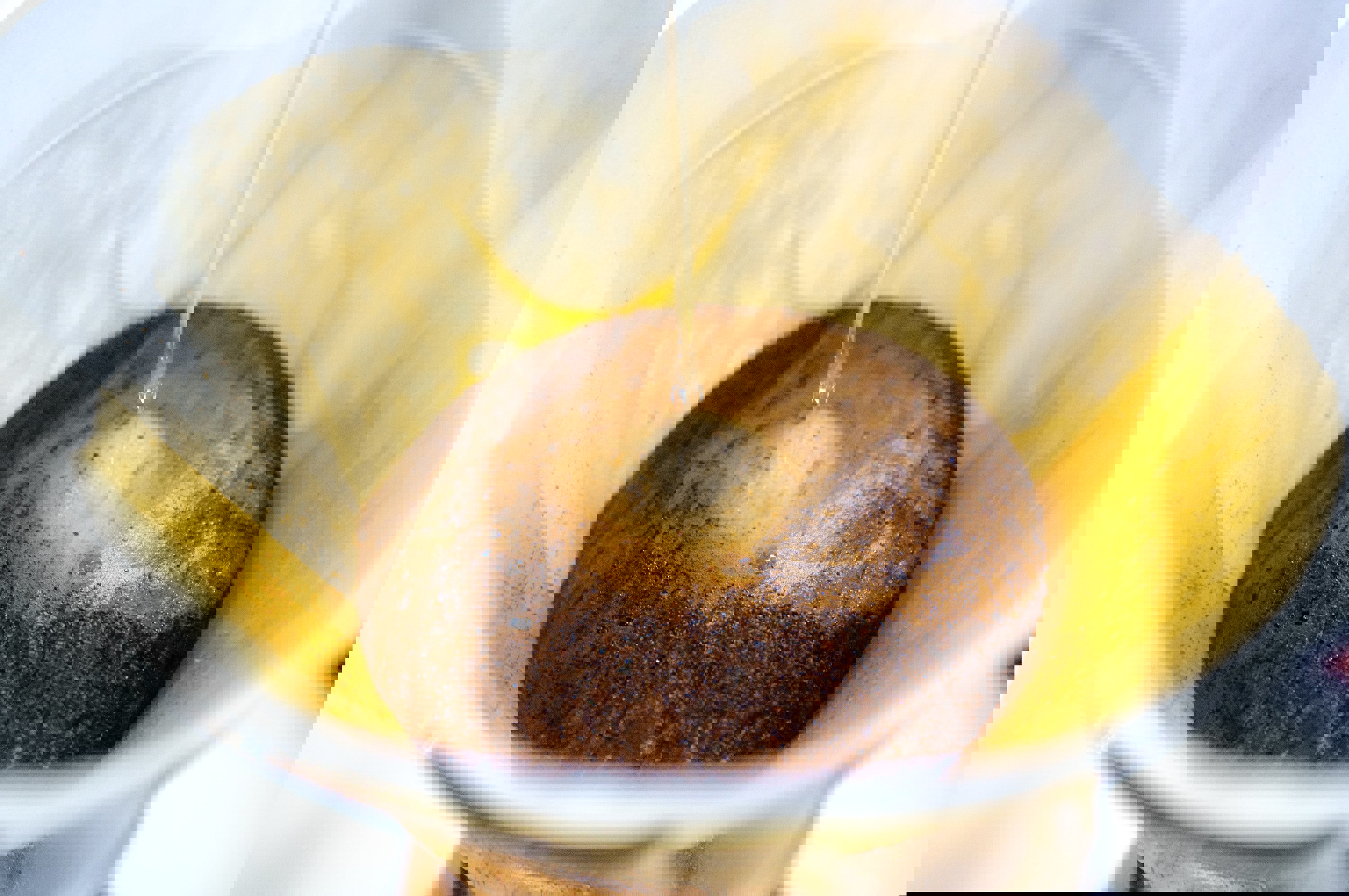 a close up of coffee being poured into a filter